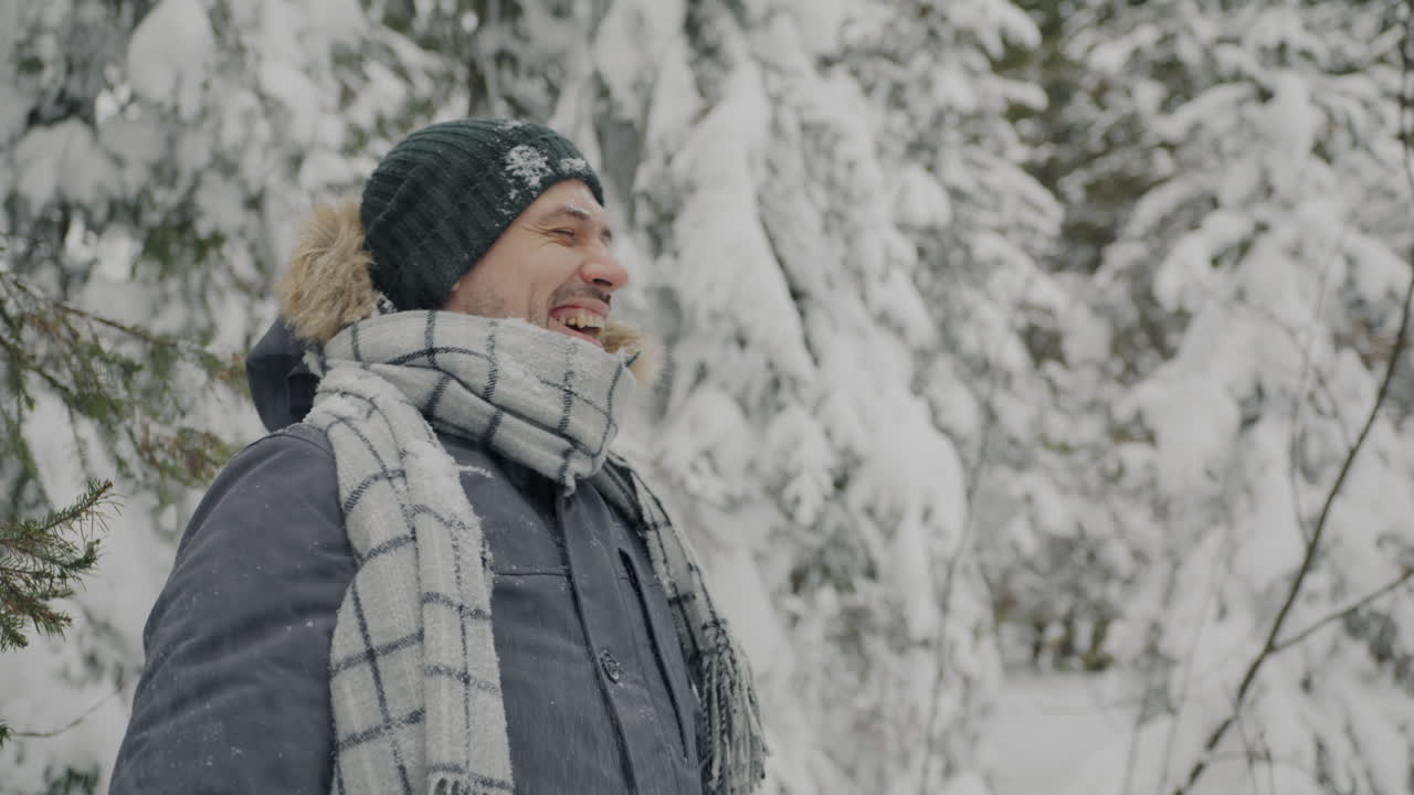 Man enjoying a snowy forest walk