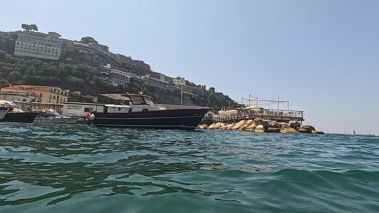 Boat approaching pier in Sorrento, Naples, Italy
