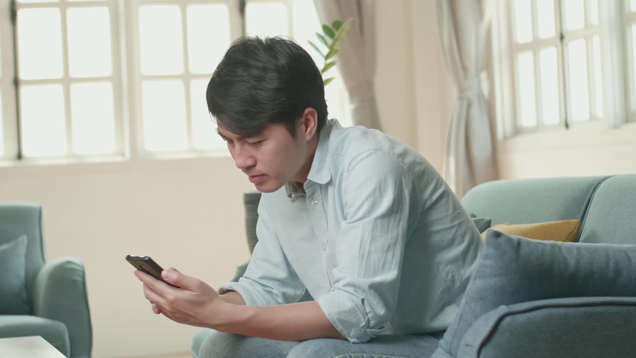 Male Using Smartphone In Living Room, Video In 4K