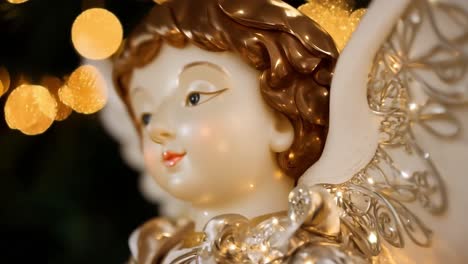 close-up of a gold and white angel ornament on a christmas tree