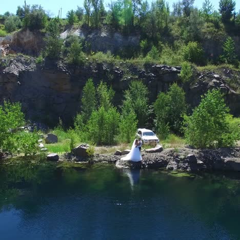 bride and groom by the river