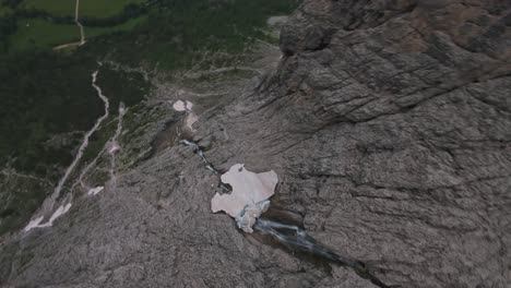 aerial view of a waterfall in the mountains
