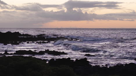 Pan-right-over-volcanic-rock-at-sunset-on-Sandy-Beach-in-Oahu,-Hawaii