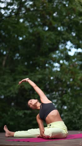 woman practicing yoga outdoors