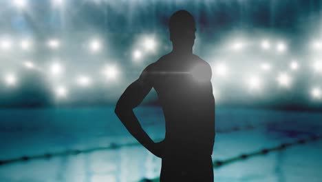 Animation-of-silhouette-of-male-swimmer-over-spotlights-and-swimming-pool