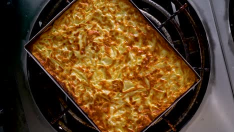 turkish burek tray above the rotating stove