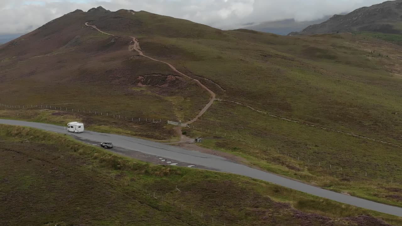 Camper Van Driving on a Scenic Mountain Road