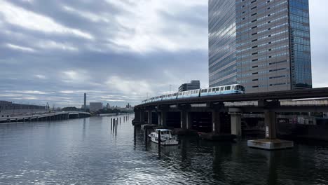 a peaceful riverside view in tokyo, japan, with calm water and urban buildings