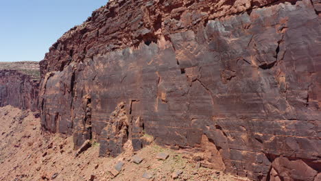 Cinematic-drone-clip-moving-parrarel-to-the-Red-Sandstone-Cliffs-in-San-Rafael-Reef-in-Utah,USA