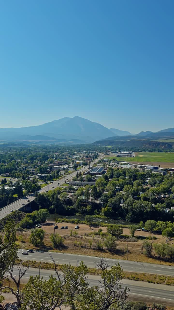 Vertical, hiking trail overlook and surrounding hills in Red Hill Carbondale Colorado area under afternoon light