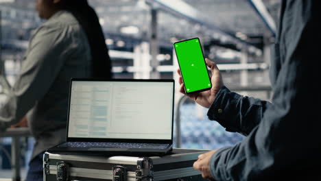 server room software developer using mockup phone