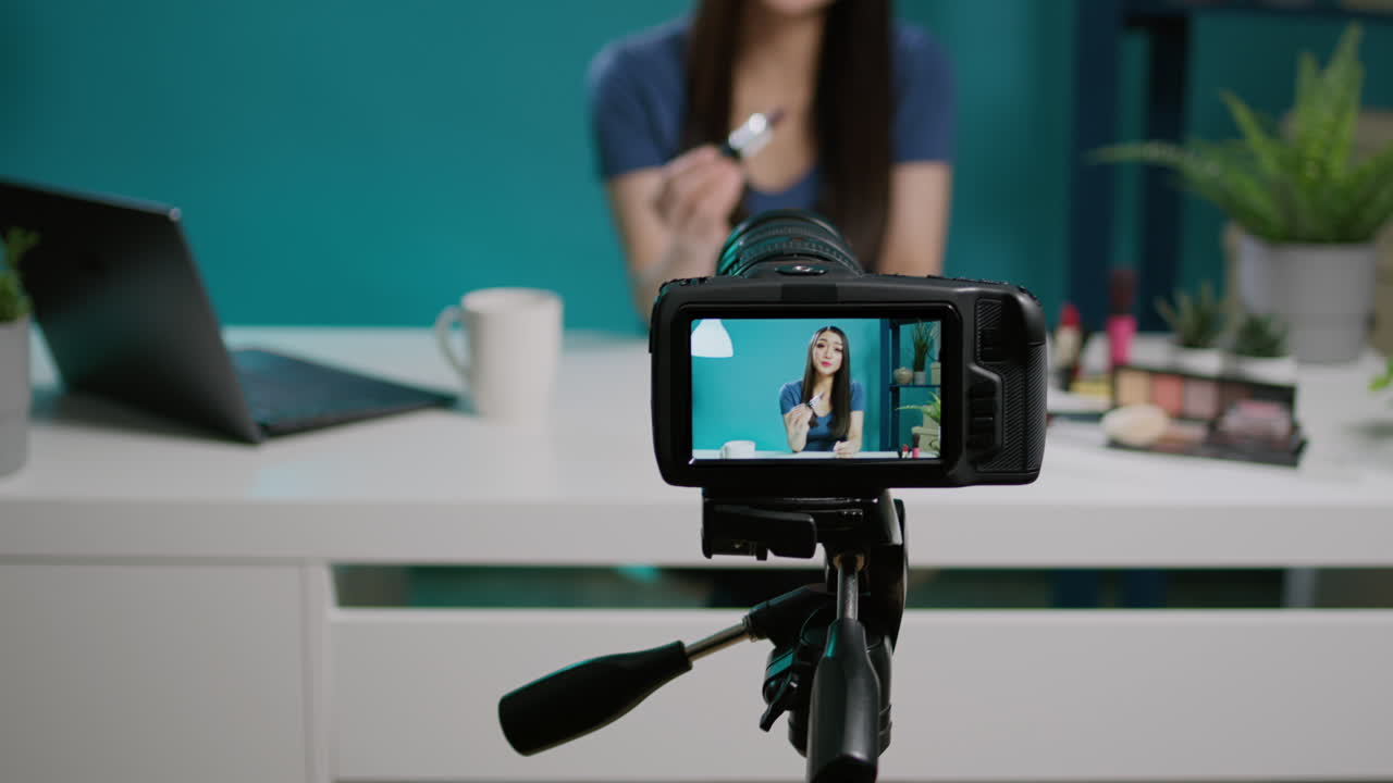 Social media blogger filming product review with camera