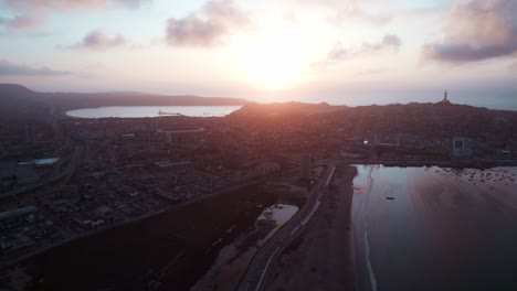 sunset sky over coquimbo city with cruz del tercer milenio in chile