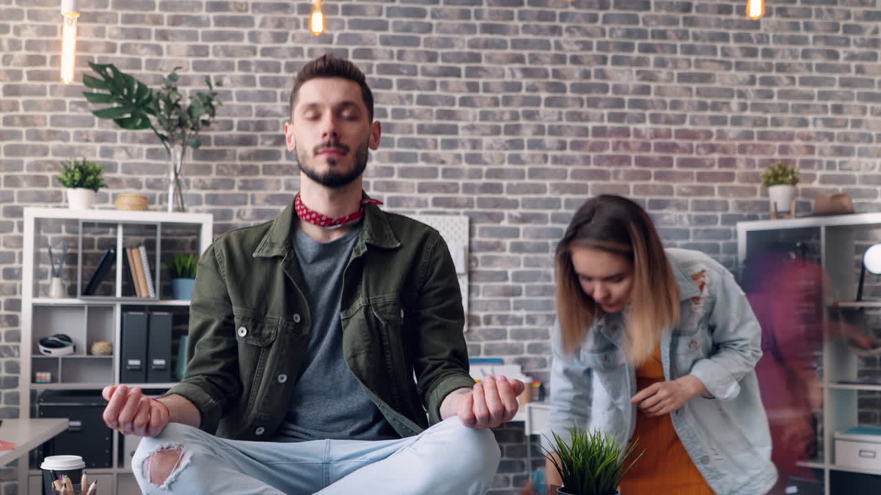 A Person Meditating in a Modern Office Environment