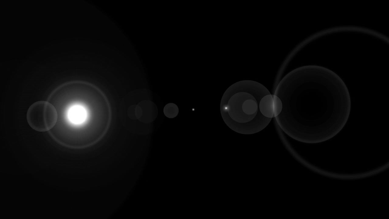 Abstract White Lens Flare Flashing on Black Background