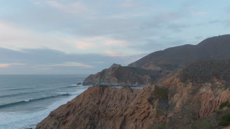 northern california ocean side mountains during winter sunset aerial 4k flight