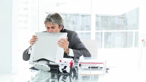 Successful-mature-businessman-at-his-desk