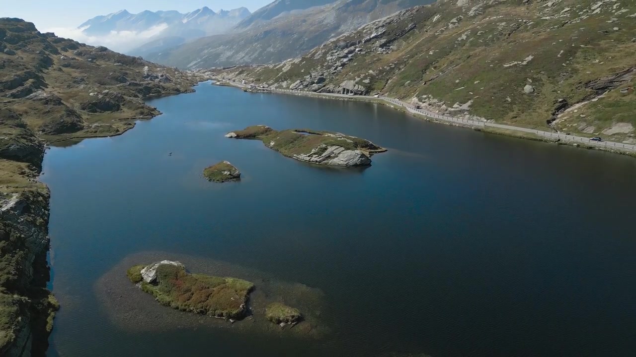 Stunning landscapes of the San Bernardino Pass in Switzerland, a breathtaking mountain route that offers panoramic views, winding roads, and serene alpine scenery.