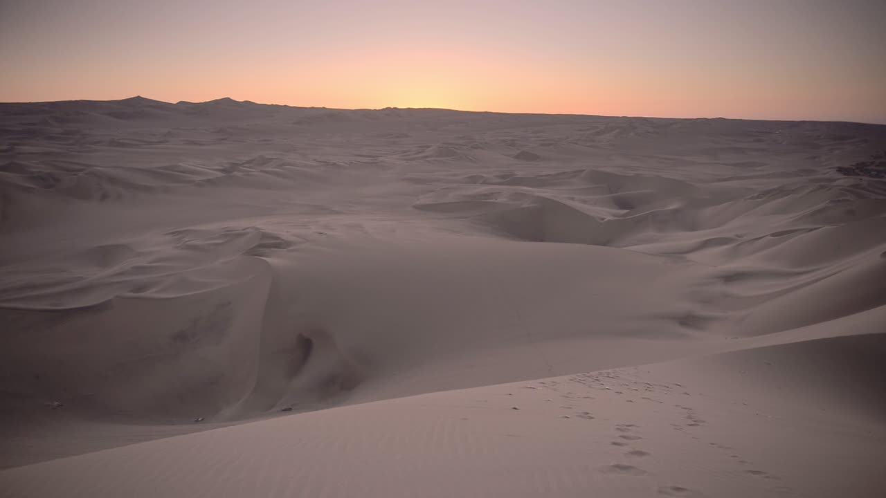 Panoramic landscape view of desert dunes, at dusk, Peru
