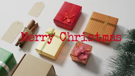 Animation-of-merry-christmas-text-over-presents