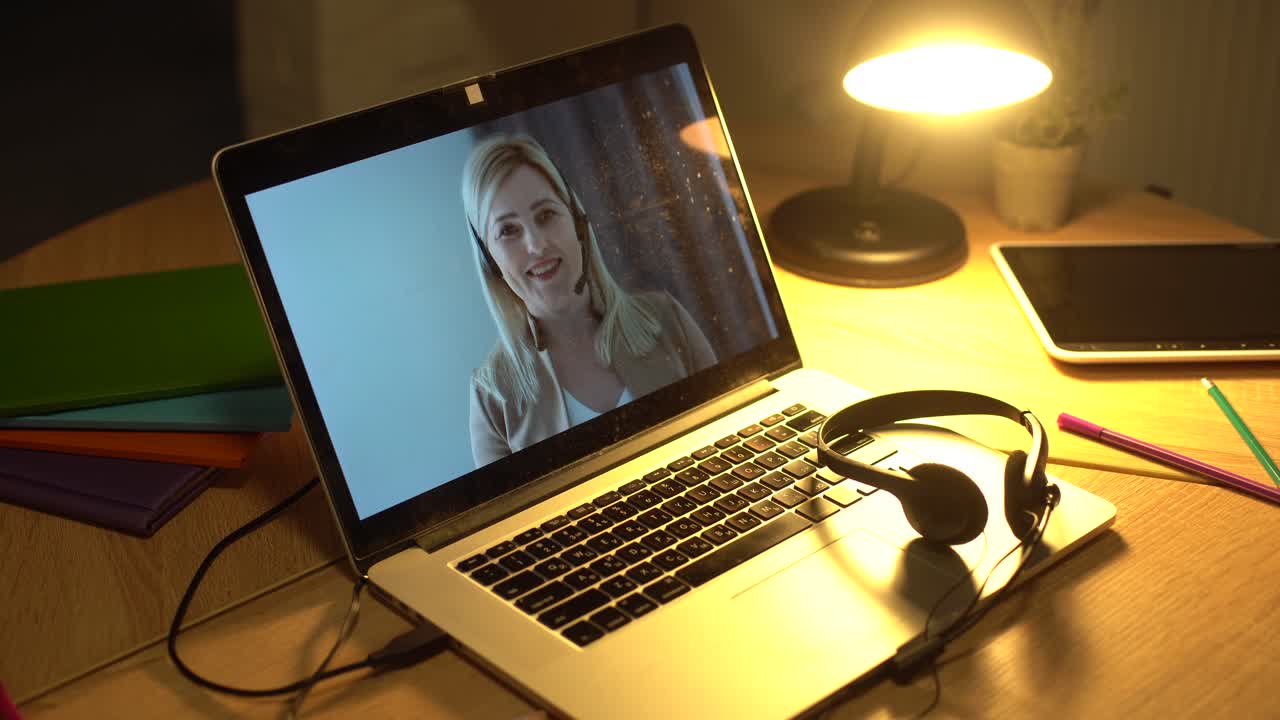 Businesswoman using laptop making video call conference with colleagues and talking, discussing business project online, working from home and Remote work