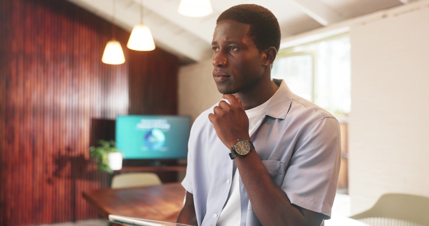 Young Man Using Digital Tablet in Modern Office
