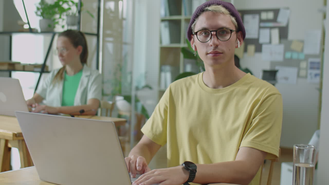 Portrait of Young Gen Z Man Working in Office