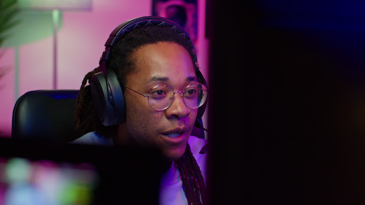 Man playing video games with headphones on