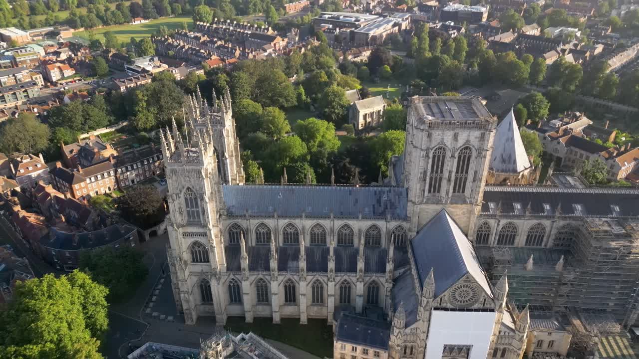 Aerial drone flyover of York Minster showing the Gothic architecture of the medieval cathedral in York, England