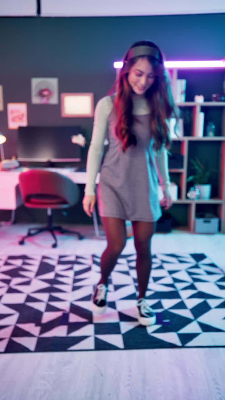 A woman in a dress stands in a room