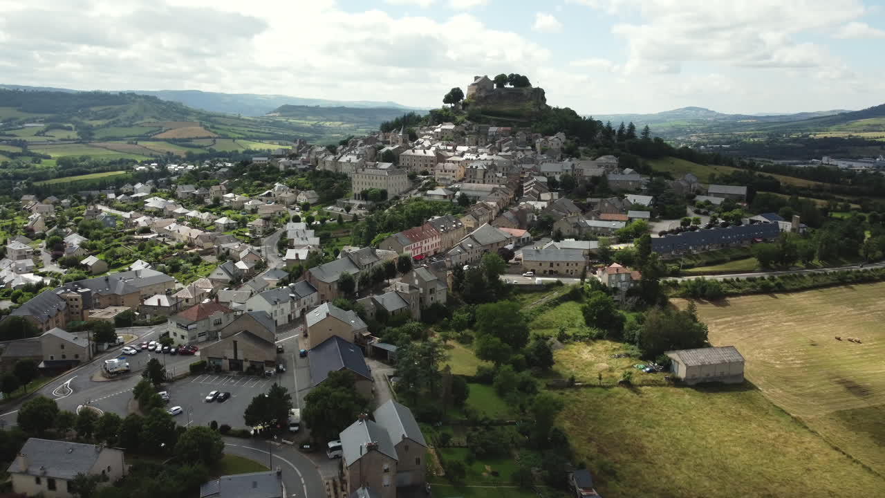 Aerial View of a Picturesque French Village with a Hilltop Castle