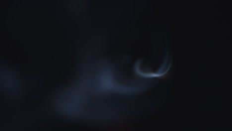 atmospheric smoke 4k fog effect. smoke in slow motion on black background. white smoke slowly floating through space against black background