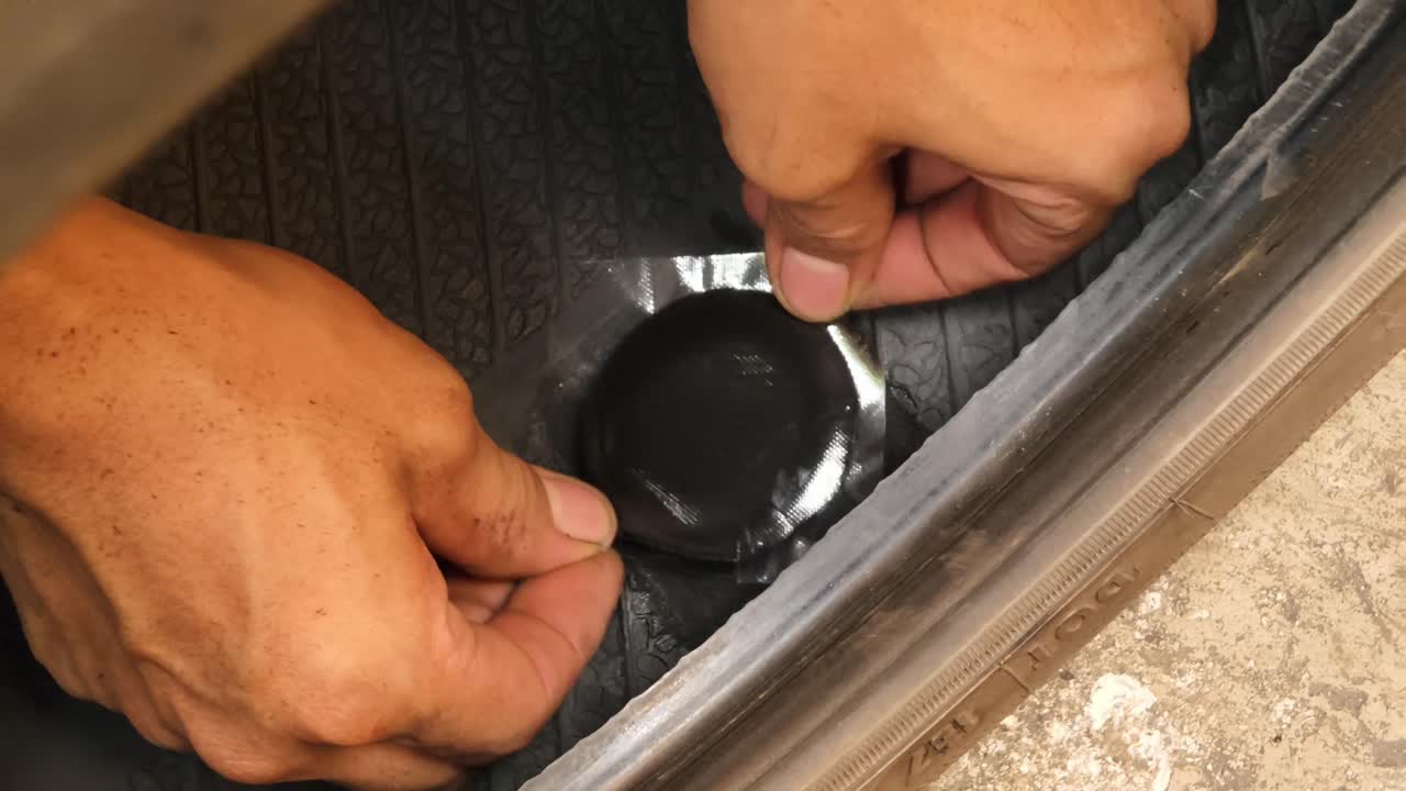 Fixing a Puncture in a Car Tire