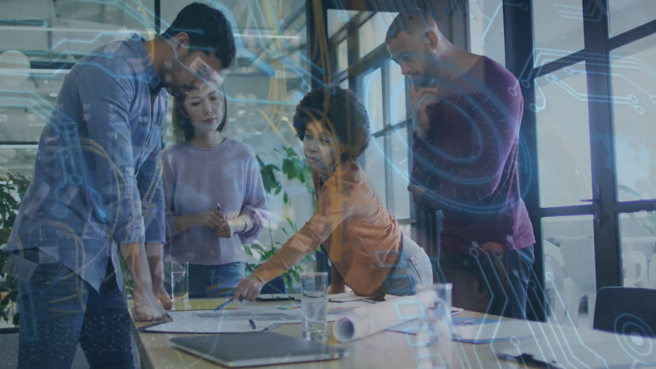 Animation of computer circuit board over diverse business people at office