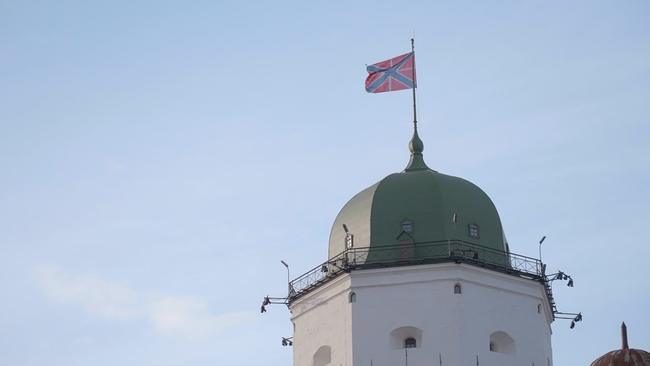 Green Dome Tower With Flag Waving Above White Stone Turret Against Clear Blue Sky, Soft Morning Light, Metal. Creative
