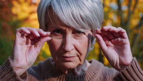 close-up portrait of an elderly woman in autumn