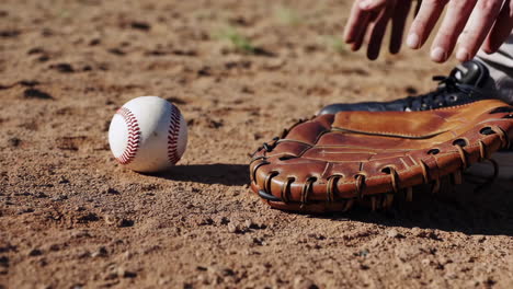 baseball glove and ball on the field