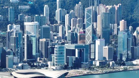 4k tele zoom view of hong kong central district - slow pan aerial view angle from sky.