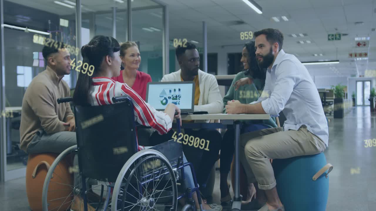 Wheelchair user tapping tablet chart team reacting reaching business goal with overlays over tablet