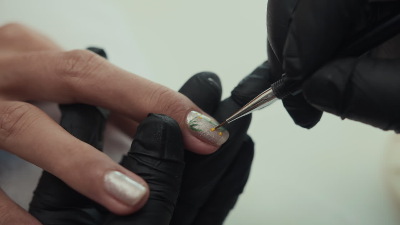 Anonymous Specialist Creating Decor on Polished Nails of Woman