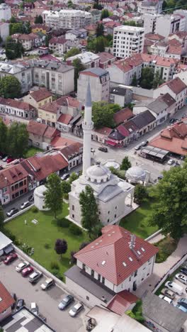 aerial view of the majestic ferhadija mosque, a prominent landmark in banja luka, bosnia and herzegovina. vertical video