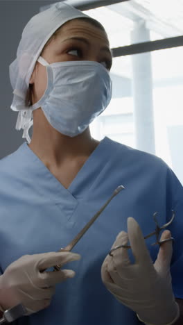 surgery team discussing while operating a patient in an operating room