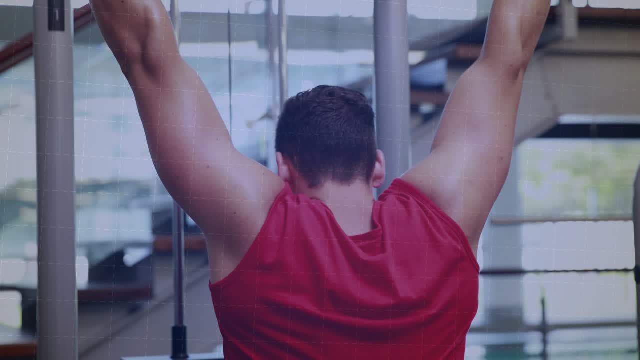 Man in gym reaching up, gripping lat bar, pulling down, engaging lats, vertical bars intensifying