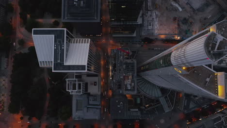 AERIAL:-Breathtaking-Overhead-Top-Down-Birds-View-Shot-of-Frankfurt-am-Main,-Germany-City-Center-Skyline-right-after-Sunset-with-little-Traffic-due-to-Coronavirus-Covid-19-Pandemic