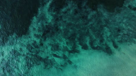 Drone-view-of-crystal-clear-water-in-Carlsbad