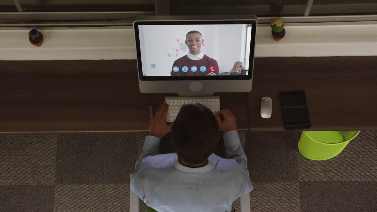 Overhead view of man having a video conference