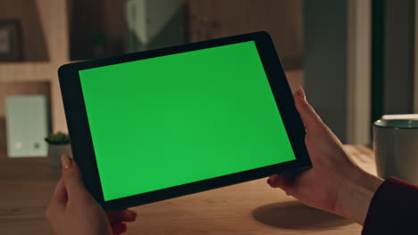 woman boss reading green screen tablet message sitting dark workplace close up.
