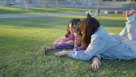 Three Friends Taking a Selfie in a Park