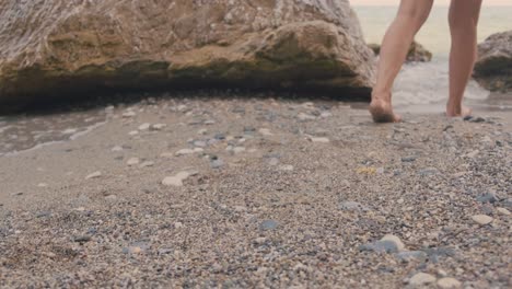 woman walking barefoot in the sand. freedom concept