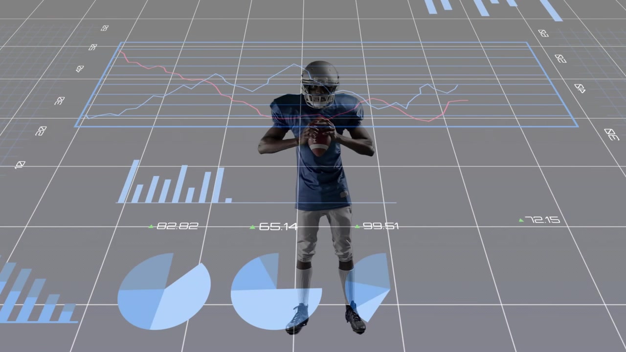 African American man walking across grid wearing helmet and shoulder pads while holding football